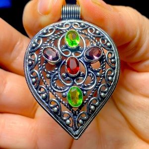 Peridot, amethyst, and garnet pendant